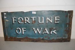 A cut down painted metal sign marked 'Fortune of War'