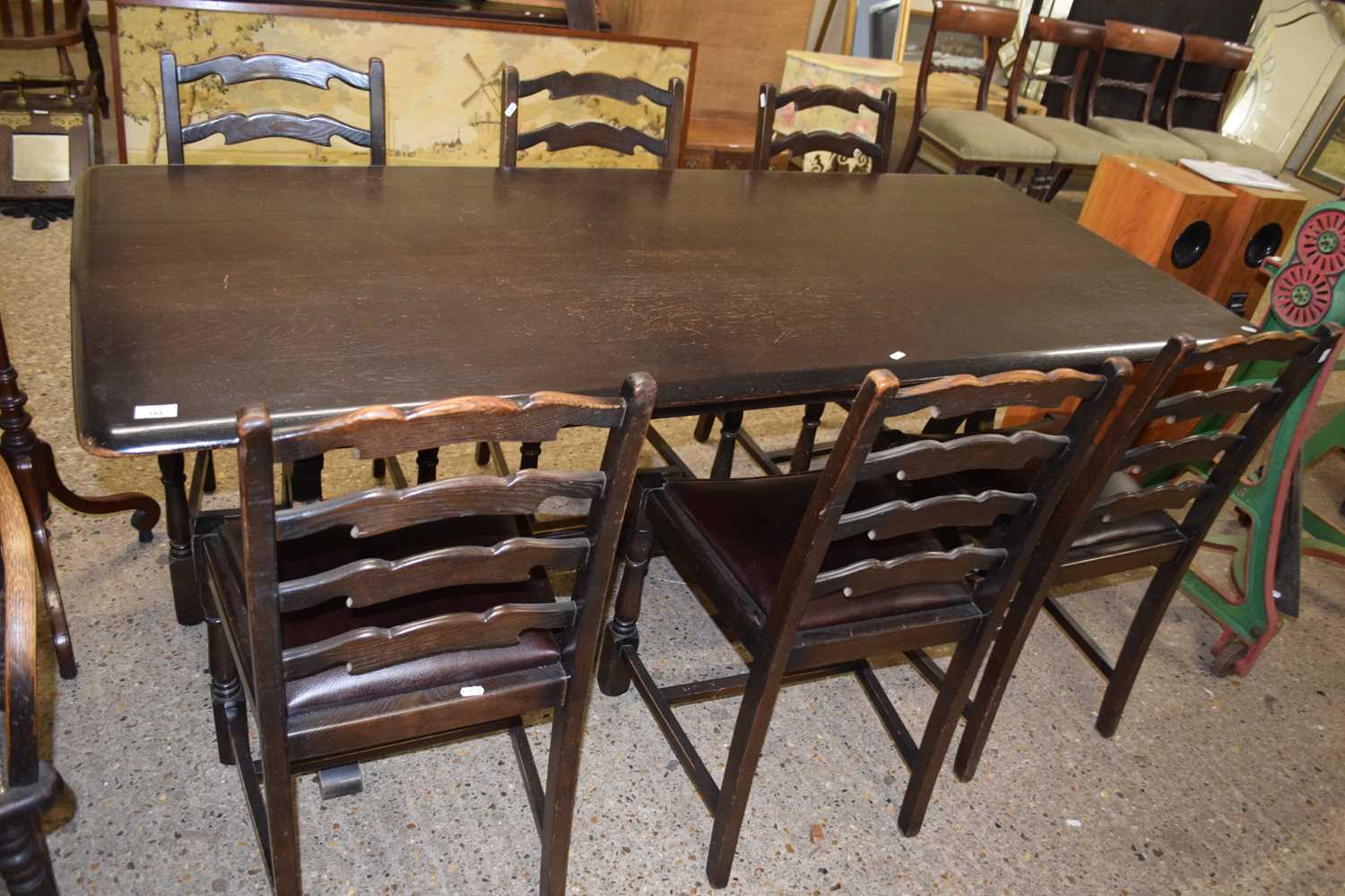 20th Century oak refectory style dining table and six ladder back chairs, table is 181cm wide