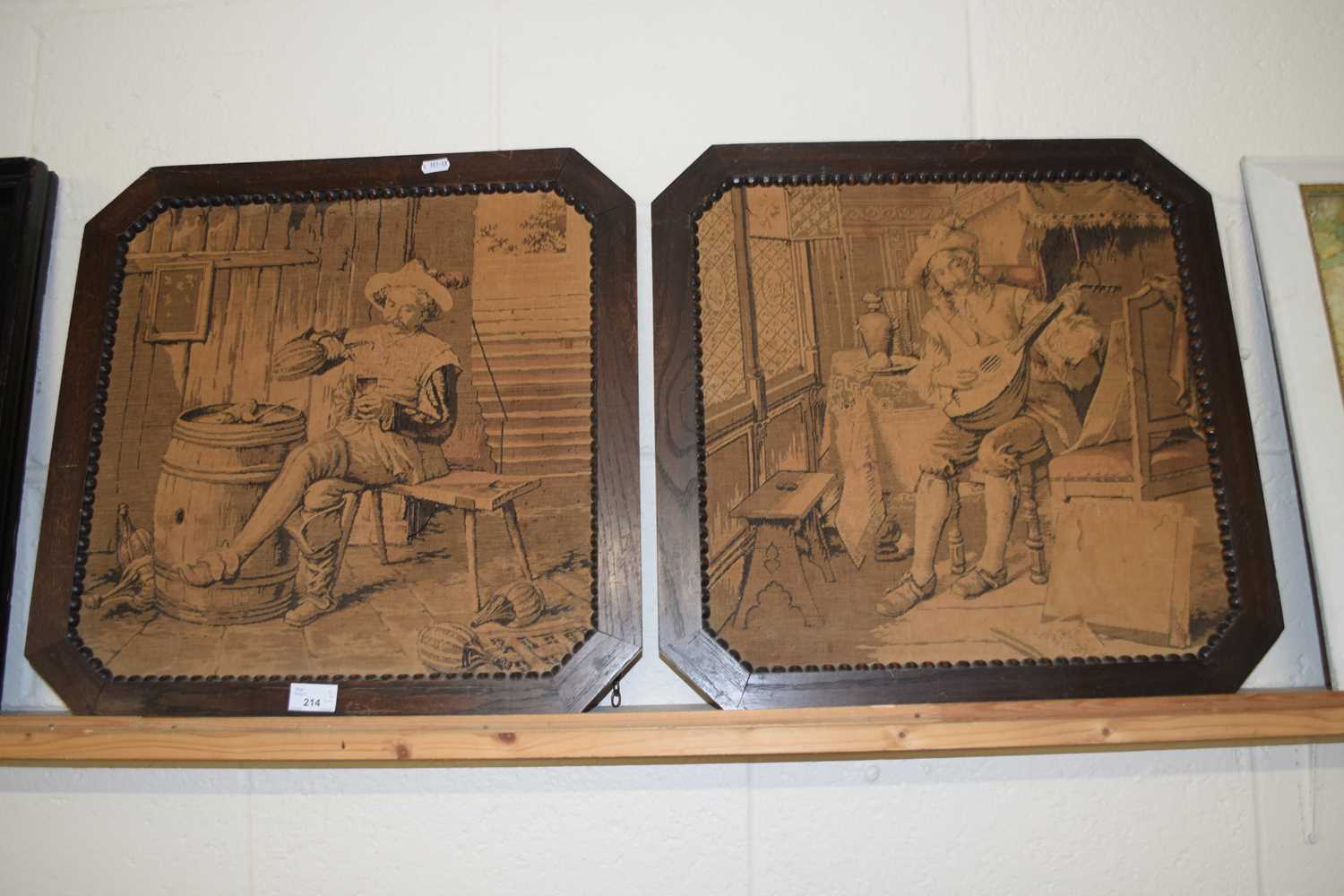 Pair of monochrome tapestry pictures, a musician and a drinker set in dark oak frames