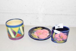 Small Moorcroft magnolia pattern oval formed vase and a similar pin tray (2)