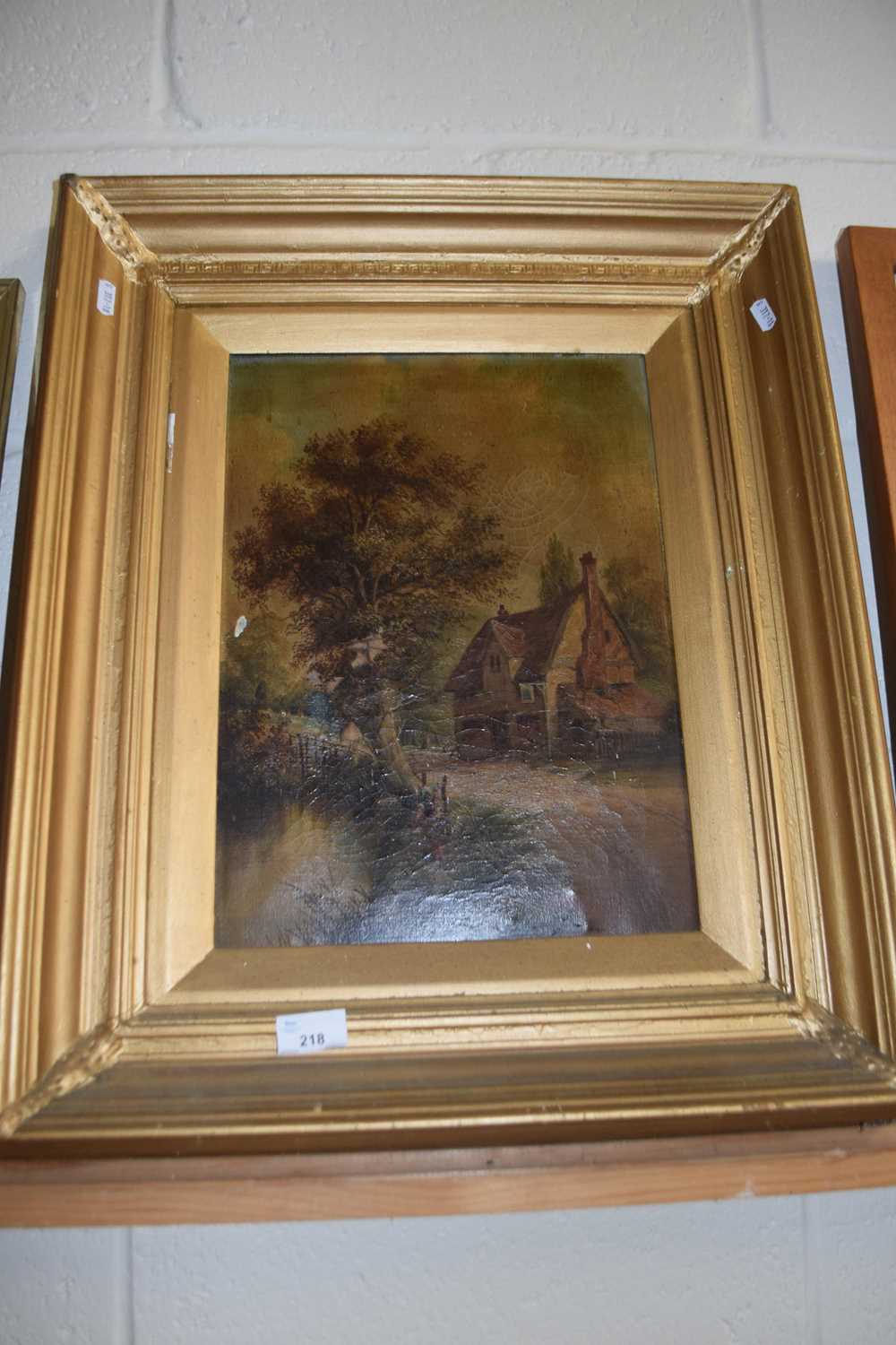 19th Century school, study of a country cottage by a riverside, oil on canvas, gilt framed (a/f)