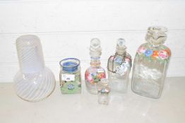 Mixed Lot: Vaseline glass decanter with cover together with further floral decorated decanters and