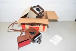 Vintage Hanimex slide projector together with a vintage Kodak 8 movie camera