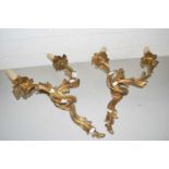 A pair of brass foliate formed twin light wall sconces
