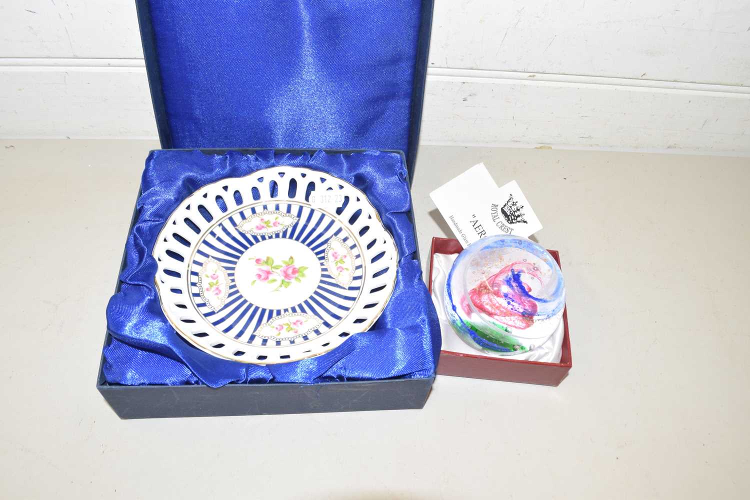 Boxed Royal Crest Aero paperweight together with a boxed porcelain dish (2)