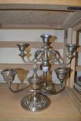Three branch silver plated candleabra together with another smaller