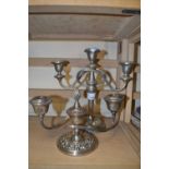 Three branch silver plated candleabra together with another smaller