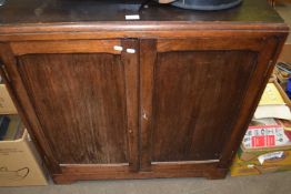 A freestanding stained pine cabinet, two doors, lockable with key
