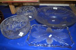 Two cut glass fruit bowls together with press moulded bowl and a glass tray