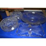 Two cut glass fruit bowls together with press moulded bowl and a glass tray