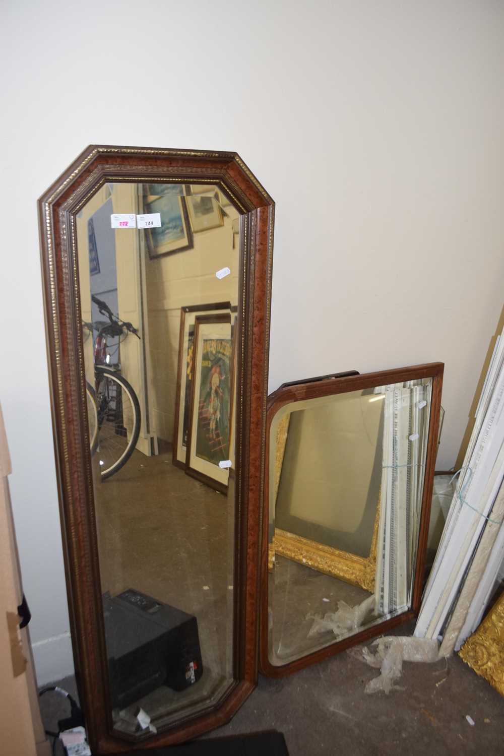 A rectangular octagonal wall mirror with faux maple and gilt surround together with an arched mantel