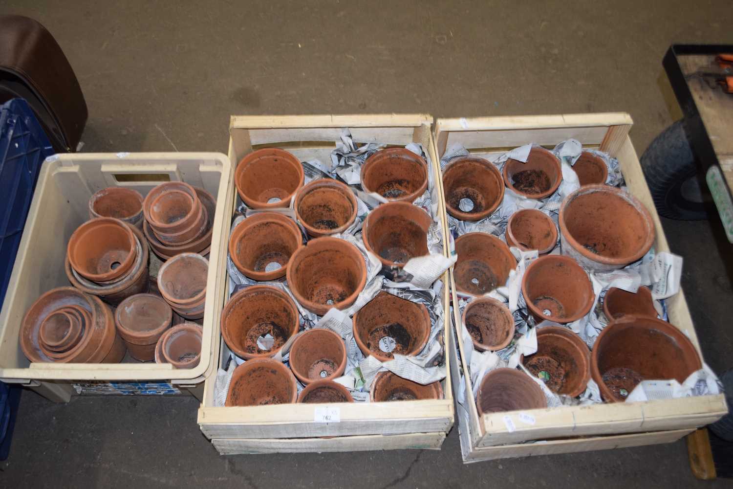 Two boxes of assorted terracotta plant pots