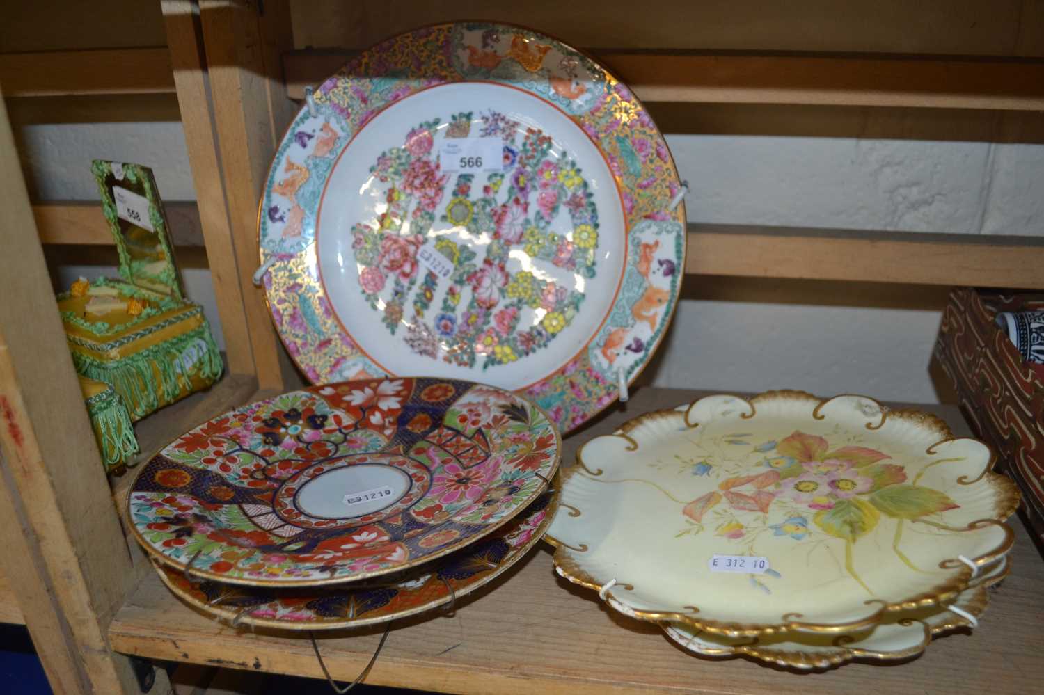 Two Imari style plates together with two floral decorated plates and another (5)