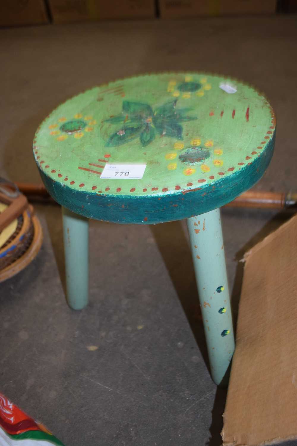 Green painted three legged stool