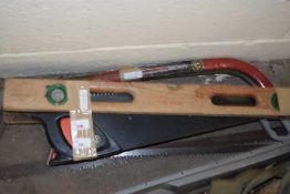 Quantity of hand saws and a wooden spirit level