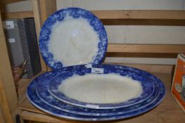 Three transfer decorated blue and white oval serving trays together with a plate