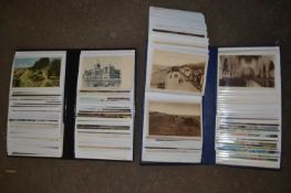 Two albums of assorted postcards