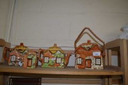 Two cottage ware teapots, biscuit barrel and a sugar bowl