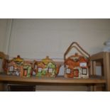 Two cottage ware teapots, biscuit barrel and a sugar bowl