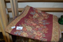 A red and floral decorate brocade table runner