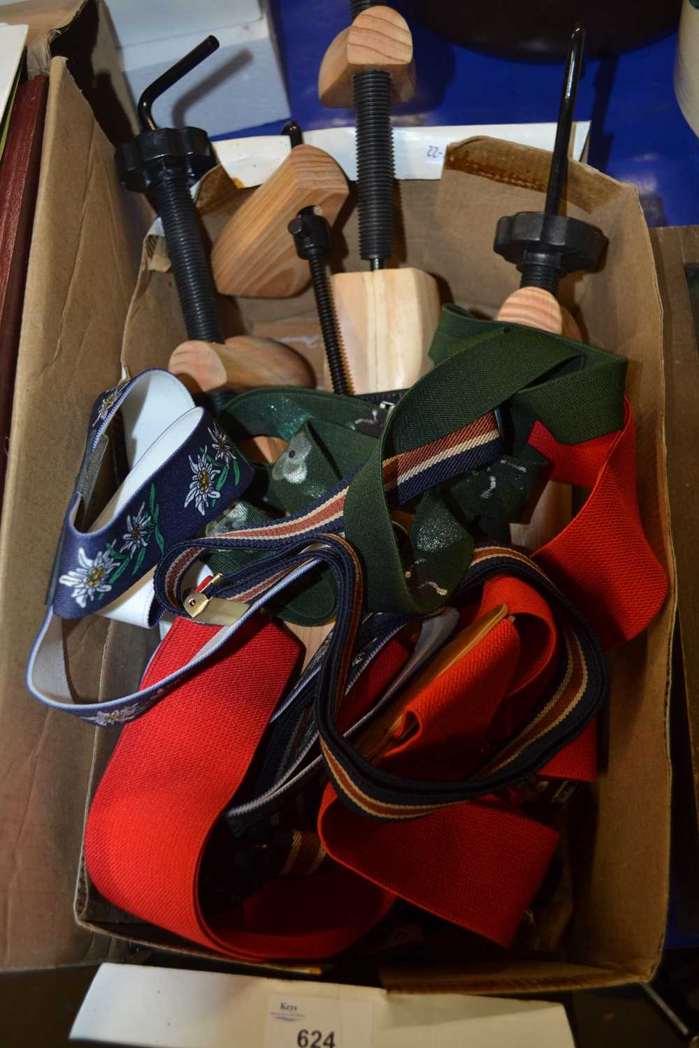 Box of assorted sized shoe trees and gentlemans braces