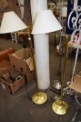 Pair of brass effect standard lamps and cream shades