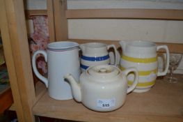 Two Cornish ware style jugs together with another and a teapot