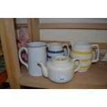 Two Cornish ware style jugs together with another and a teapot