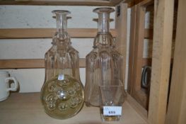 Pair of glass decanters, no stoppers together with a glass paperweight and a shot glass