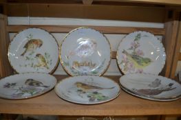 Seven hand painted plates by June Wendon of birds