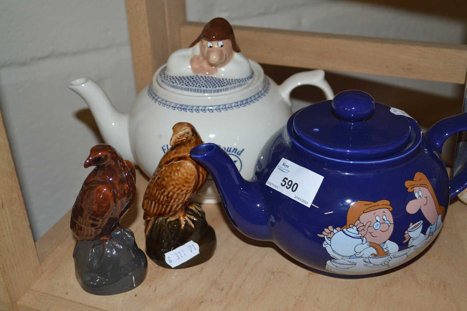 Two commemorative Tetley teapots together with two miniature Beneagles Scotch Whisky decanters