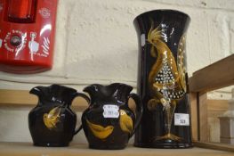 A Yeo Pottery vase decorated with a cockerel and two smaller jugs
