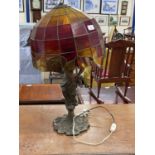 Figural table lamp with leaded glass shade