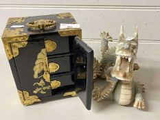 Modern Oriental black lacquered jewellery box and a accompanying modern Chinese dragon figure
