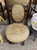 Late Victorian nursing chair with carved frame