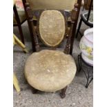 Late Victorian nursing chair with carved frame