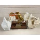 Mixed Lot: Porcelain model swans, small milk glass swan shaped container, pair of mottled glass