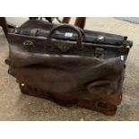 Large vintage Gladstone style leather bag and a further suitcase