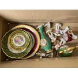 Box of Limoges gilt decorated plates and saucers, continental cherub models and other items