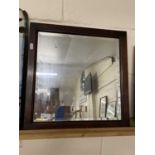 Small oak framed bevelled wall mirror