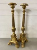 Pair of gilt finish three footed candle stands