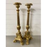 Pair of gilt finish three footed candle stands