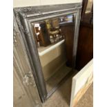 Modern rectangular bevelled wall mirror in a silvered finish frame, 110cm high