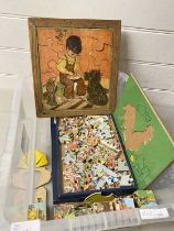 Box of vintage jigsaw puzzles, vintage building blocks etc