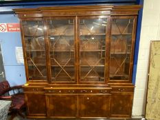Good quality large walnut veneered brake front bookcase cabinet with astragal glazed doors over a