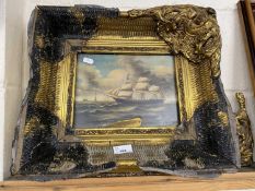 Reproduction oil of a tall ship set in a heavy gilt frame