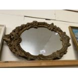 20th Century wall mirror in a foliate moulded frame