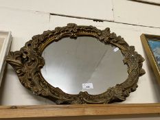20th Century wall mirror in a foliate moulded frame