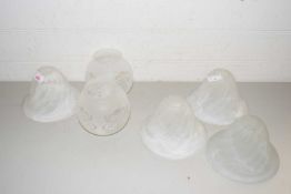 A collection of seven various frosted glass light shades