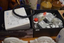 Two boxes of various electrical spares to include a hand dryer, various switches and other items